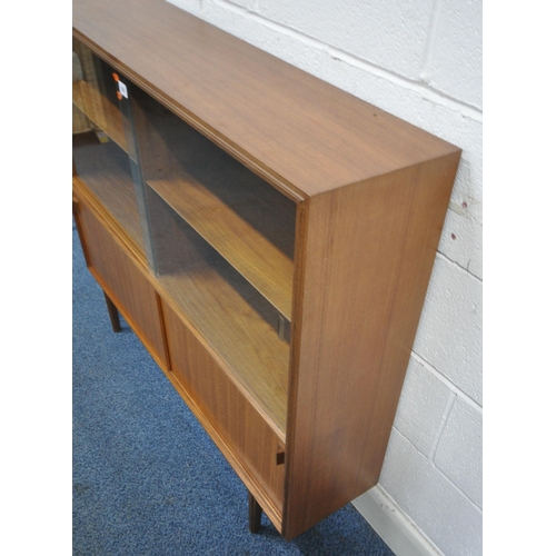 161 - POSSIBLE ROBERT HERIATGE FOR BEAVER AND TAPLEY, A MID-CENTURY TEAK BOOKCASE, with double glass slidi... 