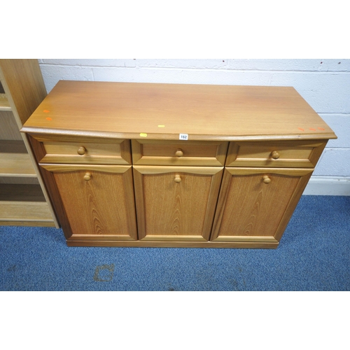 162 - A TEAK SIDEBOARD, fitted with three drawers over three cupboard doors, length 120cm x depth 49cm x h... 