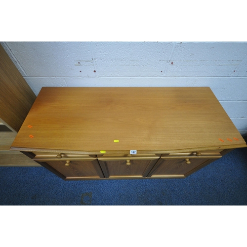 162 - A TEAK SIDEBOARD, fitted with three drawers over three cupboard doors, length 120cm x depth 49cm x h... 