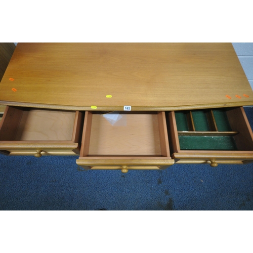 162 - A TEAK SIDEBOARD, fitted with three drawers over three cupboard doors, length 120cm x depth 49cm x h... 