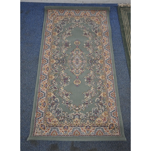 164 - A GREEN GROUND SAMARKAND RECTANGULAR RUG, with repeating foliate patterns, and a multi-strap border,... 