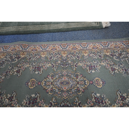 164 - A GREEN GROUND SAMARKAND RECTANGULAR RUG, with repeating foliate patterns, and a multi-strap border,... 