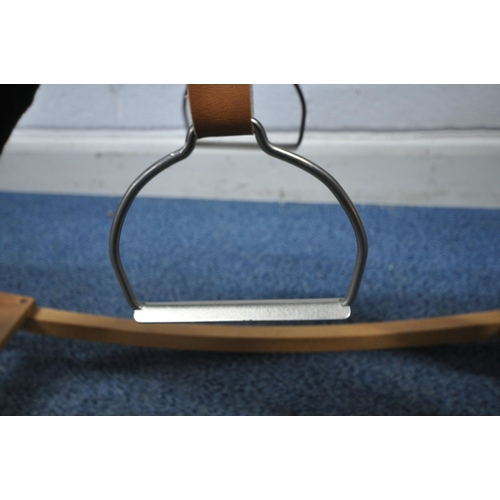 165 - A BLACK UPHOLSTERED ROCKING HORSE, height 81cm, condition report: overall good condition
