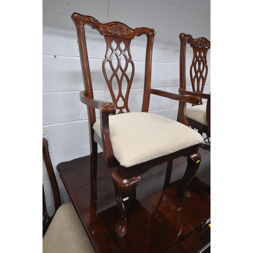 166 - A REPRODUCTION MAHOGANY TWIN PEDESTAL DINING TABLE, with one additional leaf, each leg with brass ca... 