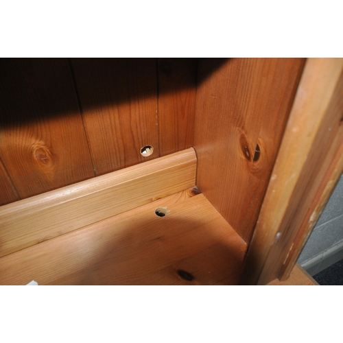 167 - A MODERN PINE DRESSER, the two tier plate rack atop a base with three drawers, over three cupboard d... 