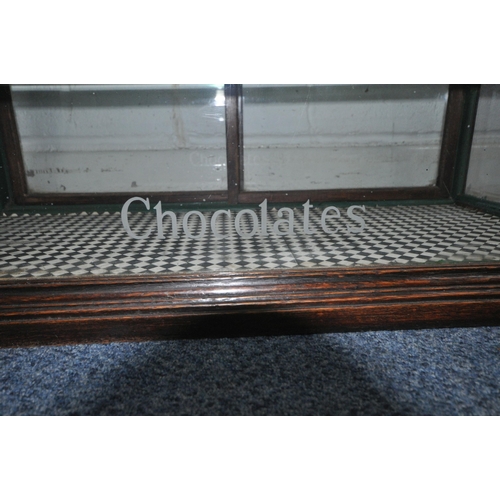 172 - A CADBURY'S CHOCOLATE COUNTER TOP DISPLAY CABINET, with rear double sliding glass doors, that are en... 