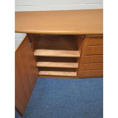 178 - SKOVBY, A MID-CENTURY TEAK SIDEBOARD, with overhanding ends, fitted with five drawers, flanked by tw... 