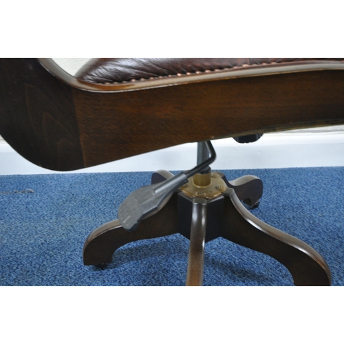 182 - A BURGUNDY LEATHER SWIVEL OFFICE CHAIR, raised on five legs with castors, width 50cm x depth 64cm x ... 