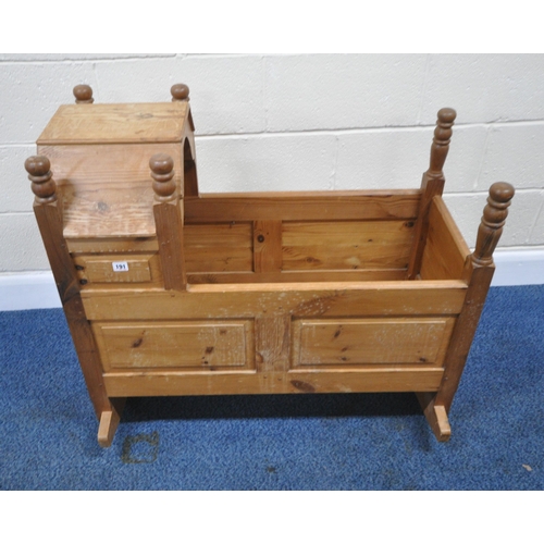 191 - A LATE 20TH CENTURY PINE ROCKING CRIB, with a raised back and hood, length 95cm x depth 54cm x heigh... 