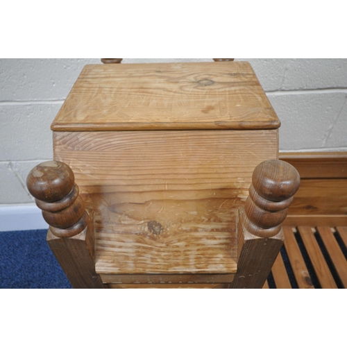 191 - A LATE 20TH CENTURY PINE ROCKING CRIB, with a raised back and hood, length 95cm x depth 54cm x heigh... 