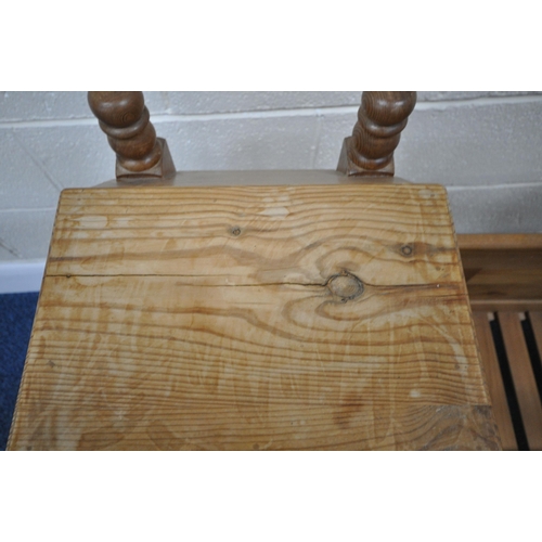191 - A LATE 20TH CENTURY PINE ROCKING CRIB, with a raised back and hood, length 95cm x depth 54cm x heigh... 