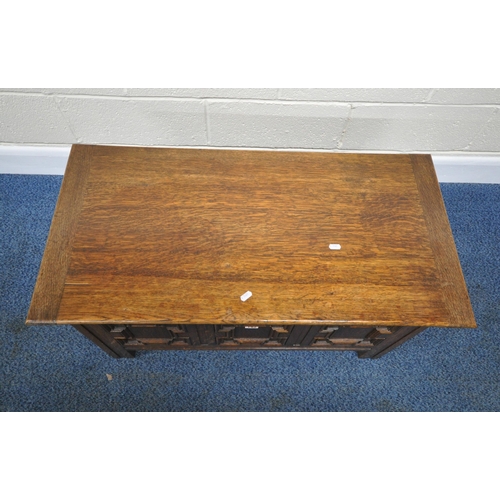 192 - A 20TH CENTURY OAK BLANKET CHEST, with three geometric panels to the front, width 91cm x depth 45cm ... 