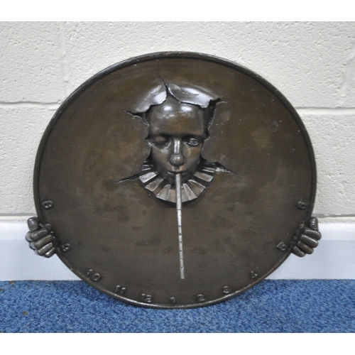 194 - ANDRE WALLACE, A BRONZE EFFECT 'CLOWN' WALL HANGING SUN DIAL, disk diameter 49cm x width 54cm x dept... 