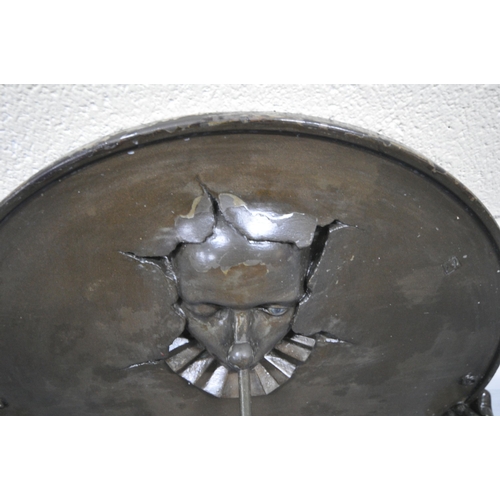 194 - ANDRE WALLACE, A BRONZE EFFECT 'CLOWN' WALL HANGING SUN DIAL, disk diameter 49cm x width 54cm x dept... 