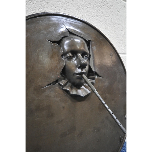 194 - ANDRE WALLACE, A BRONZE EFFECT 'CLOWN' WALL HANGING SUN DIAL, disk diameter 49cm x width 54cm x dept... 