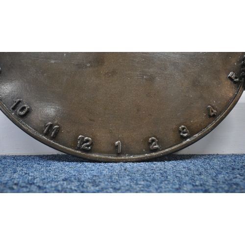 194 - ANDRE WALLACE, A BRONZE EFFECT 'CLOWN' WALL HANGING SUN DIAL, disk diameter 49cm x width 54cm x dept... 