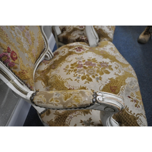 198 - A PAIR OF PAINTED FRENCH ARMCHAIRS, with gold foliate details, floral upholstery, raised on front ca... 