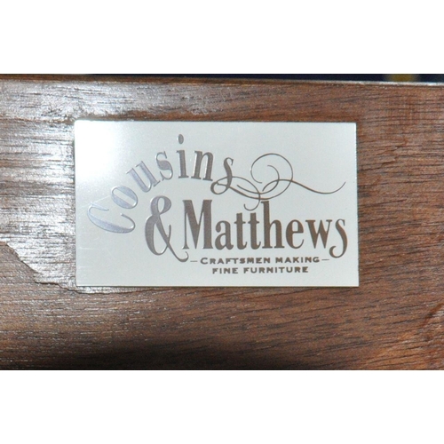 201 - COUSINS AND MATTHEWS, AN ELM CHEST OF THREE DRAWERS, with a small raised back, width 85cm x depth 48... 