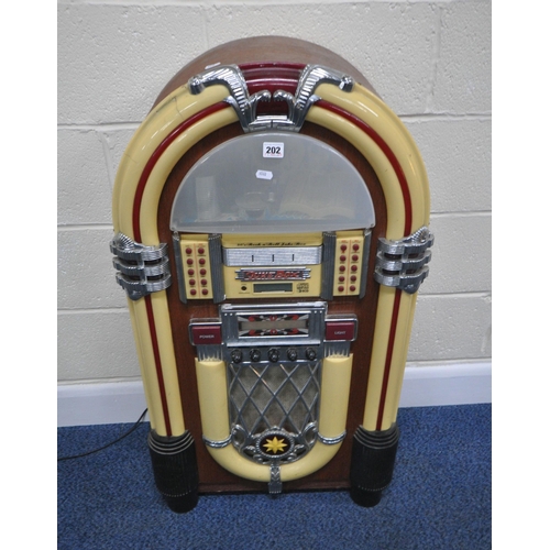 202 - A MODERN 1950'S STYLE JUKEBOX, with a six disk, radio, FM, AM, and cassette function, optional light... 