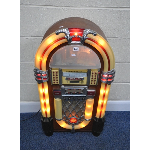 202 - A MODERN 1950'S STYLE JUKEBOX, with a six disk, radio, FM, AM, and cassette function, optional light... 