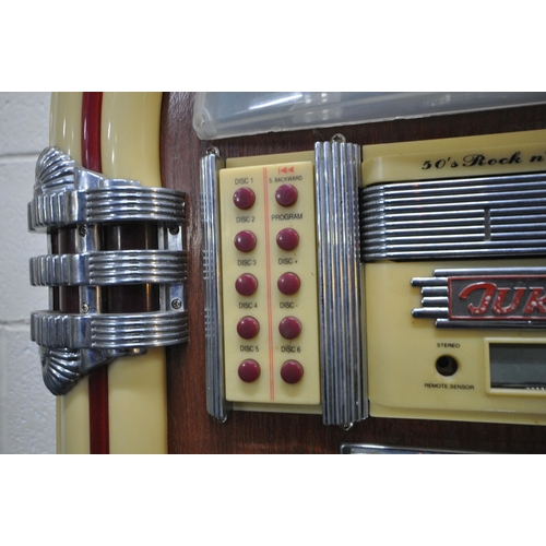 202 - A MODERN 1950'S STYLE JUKEBOX, with a six disk, radio, FM, AM, and cassette function, optional light... 