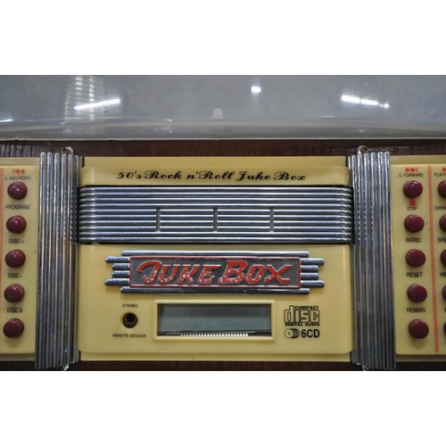 202 - A MODERN 1950'S STYLE JUKEBOX, with a six disk, radio, FM, AM, and cassette function, optional light... 