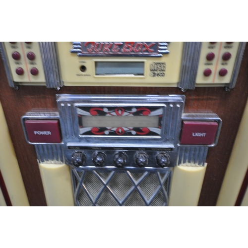 202 - A MODERN 1950'S STYLE JUKEBOX, with a six disk, radio, FM, AM, and cassette function, optional light... 