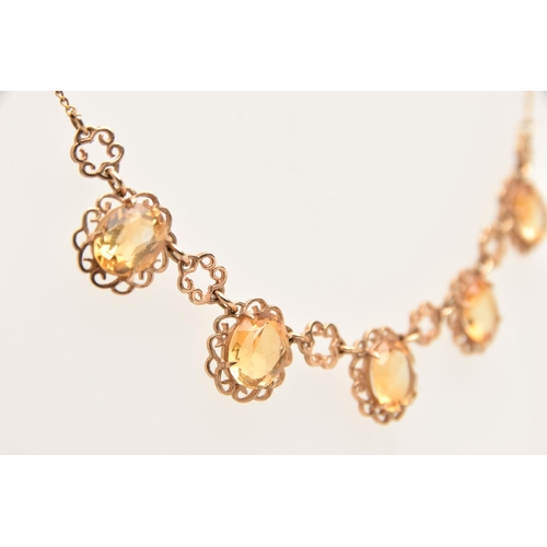 430 - A 9CT GOLD CITRINE NECKLACE, set with five oval cut Citrine's each in a four claw setting within an ... 