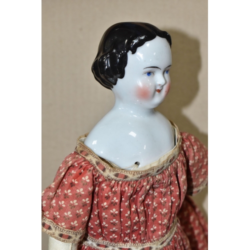 1020 - A NINETEENTH CENTURY PORCELAIN HEAD DOLL, with hand stitched cloth body and legs, kid leather arms a...