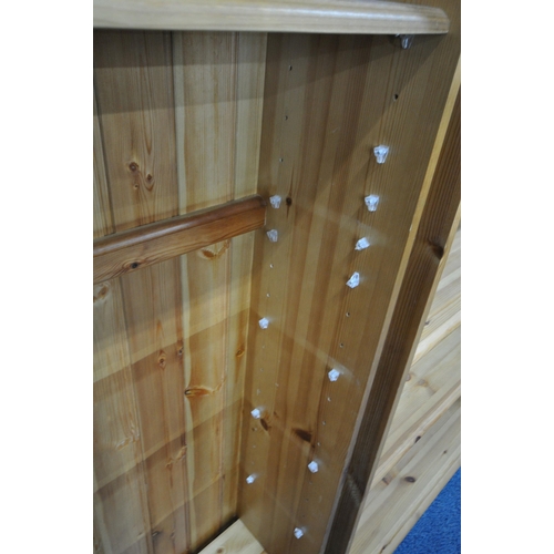 145 - TWO MODERN PINE SHALLOW BOOKCASES, with a large quantity of shelves, largest width 91cm x depth 27cm... 