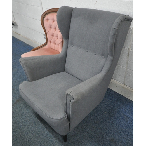 146 - A GREY UPHOLSTERED WINGBACK ARMCHAIR, width 82cm x depth 100cm x height 100cm, along with a reproduc... 