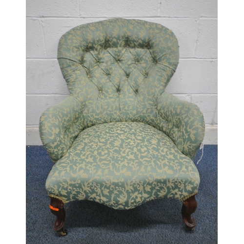 148 - A VICTORIAN BUTTON BALLOON BACK ARMCHAIR, with scrolled armrests, serpentine fronted seat, raised on... 