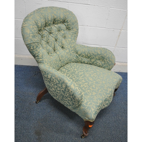 148 - A VICTORIAN BUTTON BALLOON BACK ARMCHAIR, with scrolled armrests, serpentine fronted seat, raised on... 