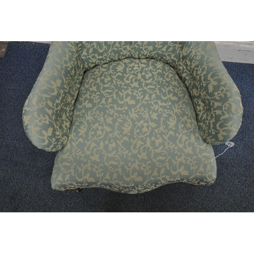 148 - A VICTORIAN BUTTON BALLOON BACK ARMCHAIR, with scrolled armrests, serpentine fronted seat, raised on... 