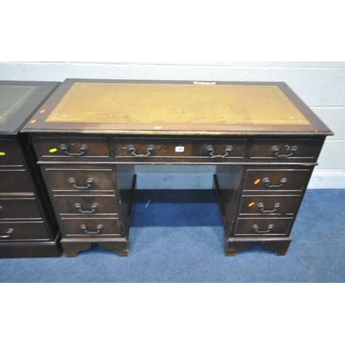 155 - A 20TH CENTURY MAHOGANY TWIN PEDESTAL DESK, with a tanned leather writing surface, and eight assorte... 
