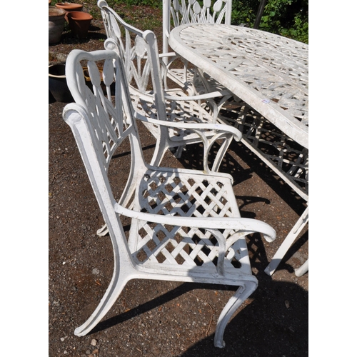1 - A CAST ALUMINIUM GARDEN TABLE AND SIX MATCHING CARVER CHAIRS, with tulip detailing to all, table 176... 