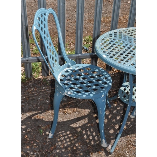 4 - A CAST ALUMINIUM GARDEN TABLE AND TWO MATCHING CHAIRS table diameter 61cm, Condition report: paint l... 
