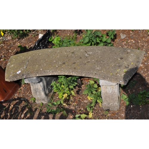 9 - A CONCRETE GARDEN BENCH, with a curved seat and scrolled bases, length 128cm, Condition Report: aggr... 