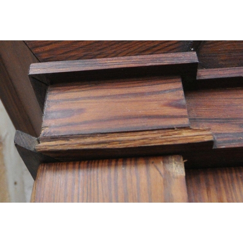 151 - A 19TH CENTURY PITCH PINE WARDROBE, fitted with two large doors, flanking smaller double doors over ... 