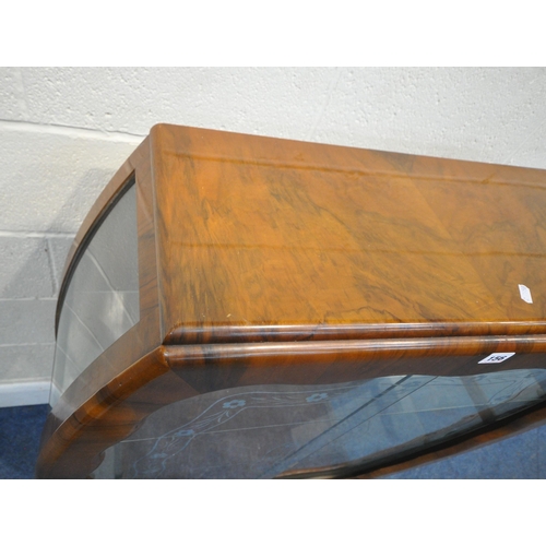156 - AN ART DECO WALNUT CHINA CABINET, the double glass sliding doors with foliate patterns, that are enc... 