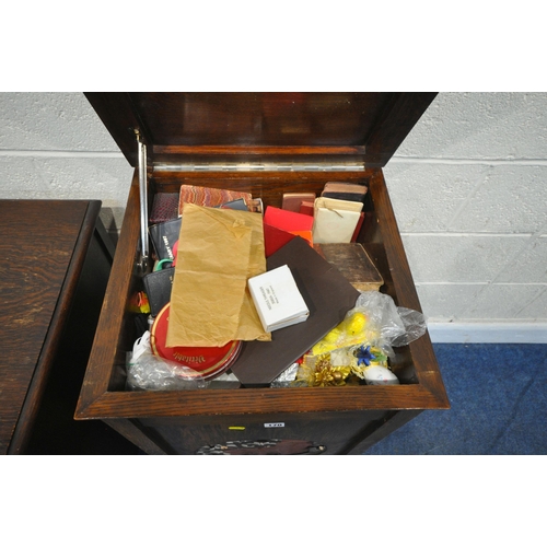 170 - AN EARLY 20TH CENTURY OAK MEDIA CABINET, with a hinged lid, a distressed fretwork front, and a singl... 