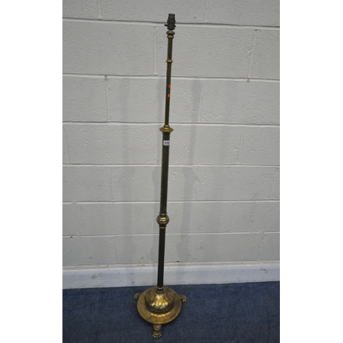 172 - A BRASS TELESCOPIC STANDARD LAMP, on a circular stepped base, with three paw feet, maximum height 16... 