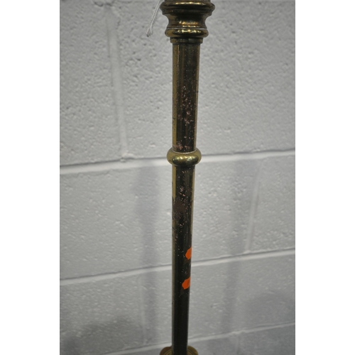 172 - A BRASS TELESCOPIC STANDARD LAMP, on a circular stepped base, with three paw feet, maximum height 16... 