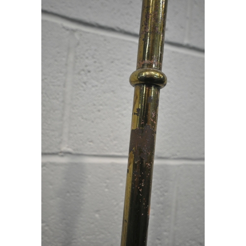 172 - A BRASS TELESCOPIC STANDARD LAMP, on a circular stepped base, with three paw feet, maximum height 16... 