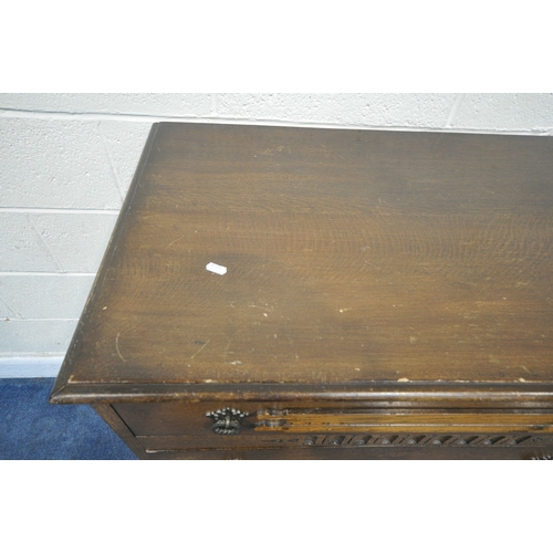 185 - A 20TH CENTURY OAK CHEST OF FOUR DRAWERS, raised on castors, width 87cm x depth 42cm x height 108cm,... 