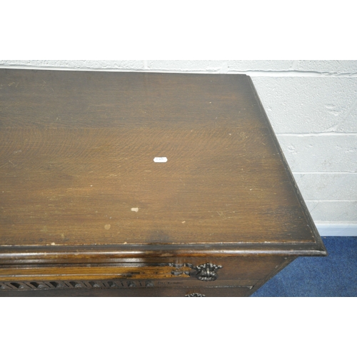 185 - A 20TH CENTURY OAK CHEST OF FOUR DRAWERS, raised on castors, width 87cm x depth 42cm x height 108cm,... 