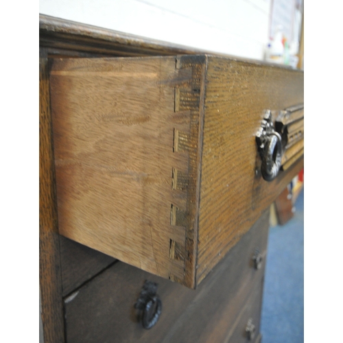185 - A 20TH CENTURY OAK CHEST OF FOUR DRAWERS, raised on castors, width 87cm x depth 42cm x height 108cm,... 