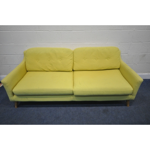 201 - A MODERN LIME GREEN UPHOLSTERED SOFA, raised on cylindrical tapered legs, length 202cm x depth 90cm ... 