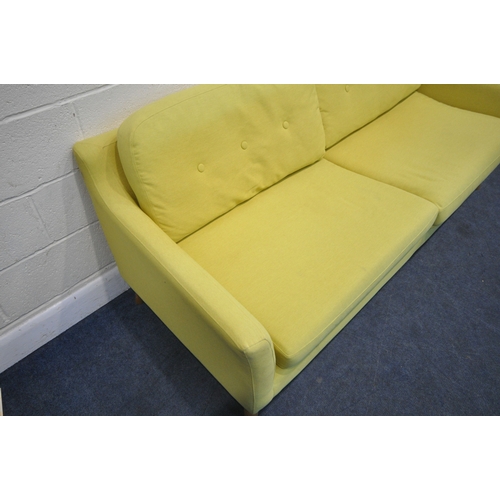 201 - A MODERN LIME GREEN UPHOLSTERED SOFA, raised on cylindrical tapered legs, length 202cm x depth 90cm ... 