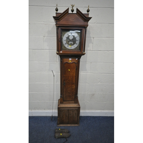 213 - A GEORGIAN OAK EIGHT DAY LONGCASE CLOCK, the hood with a broken arch pediment, three brass finials, ... 